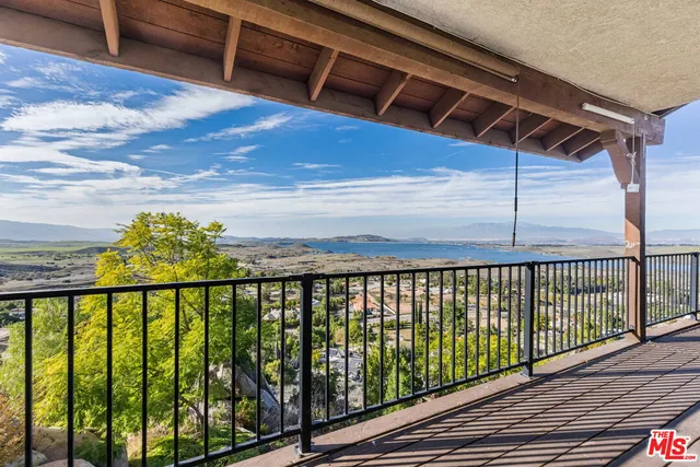 a balcony with furniture and city view