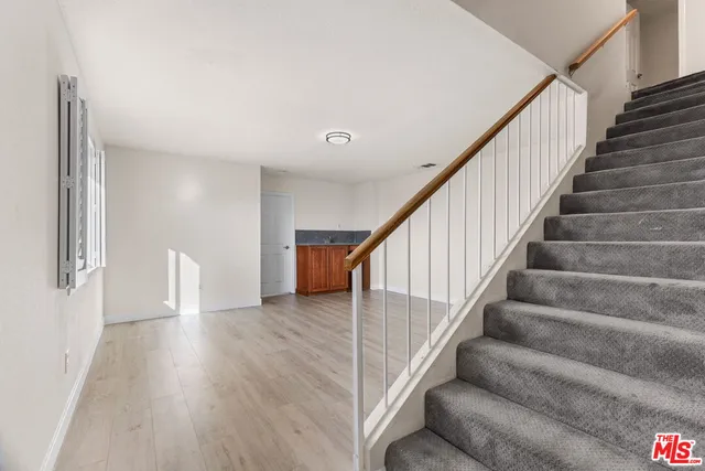 a view of room with wooden floor
