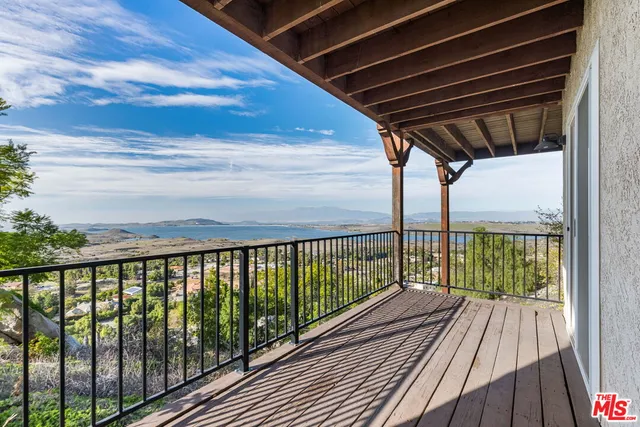 a view of a balcony with an ocean view
