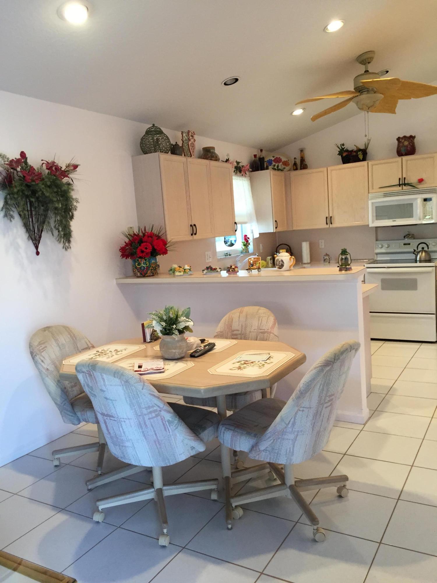 168 Cove Road Greenacres, FL 33413 - Photo 11 of 29 Breakfast Area with Snack Bar