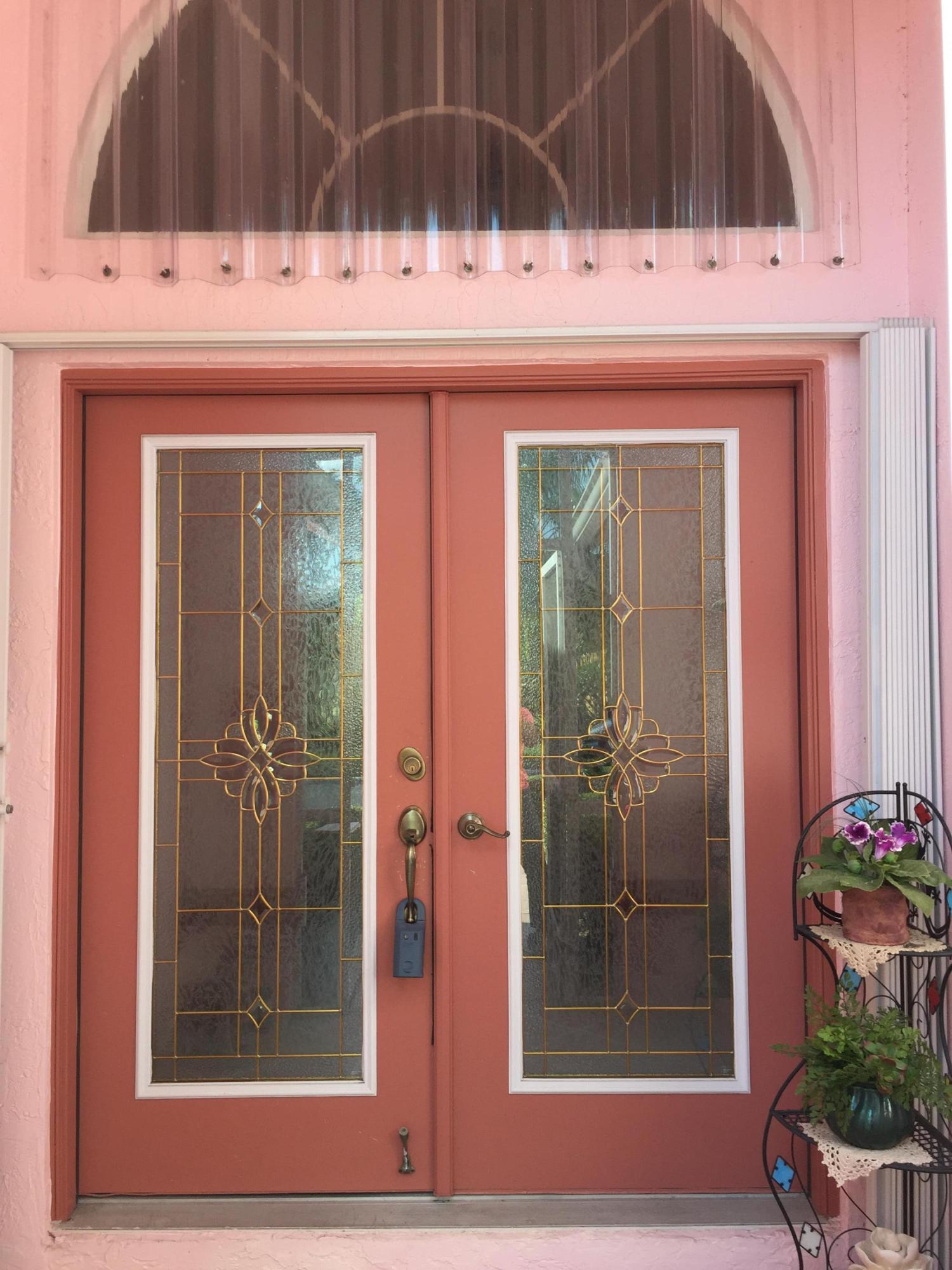 168 Cove Road Greenacres, FL 33413 - Photo 2 of 29 Double Dr Entry from screened Porch