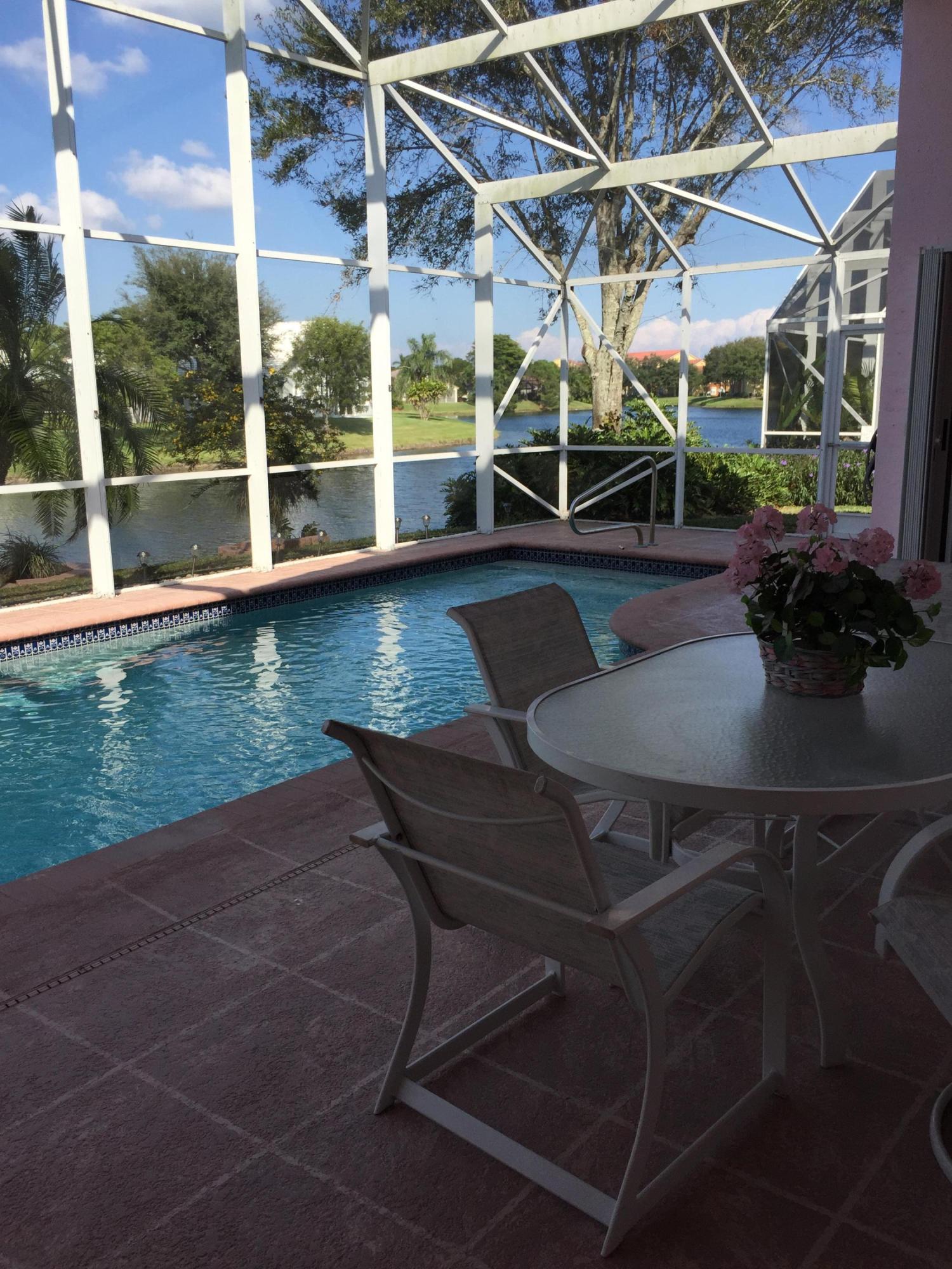 168 Cove Road Greenacres, FL 33413 - Photo 26 of 29 Screened Pool