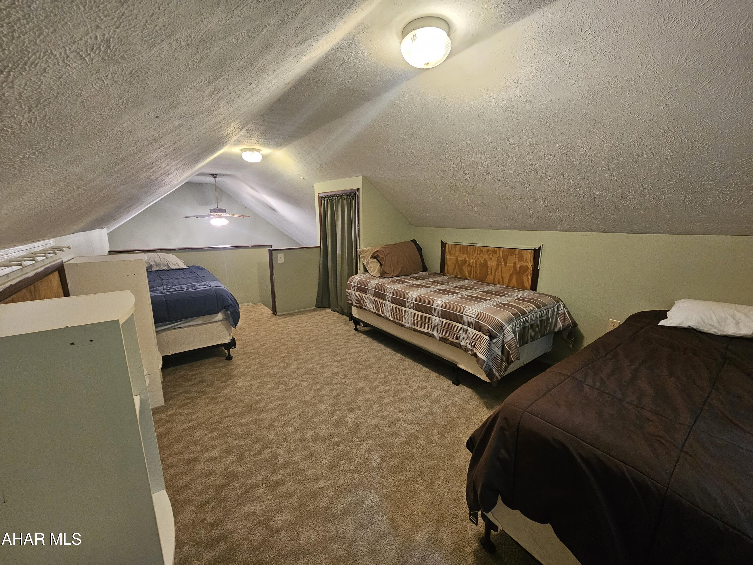 207 Kendrick Lane Flinton, PA 16640 - Photo 23 of 30 a bedroom with two beds and a couch