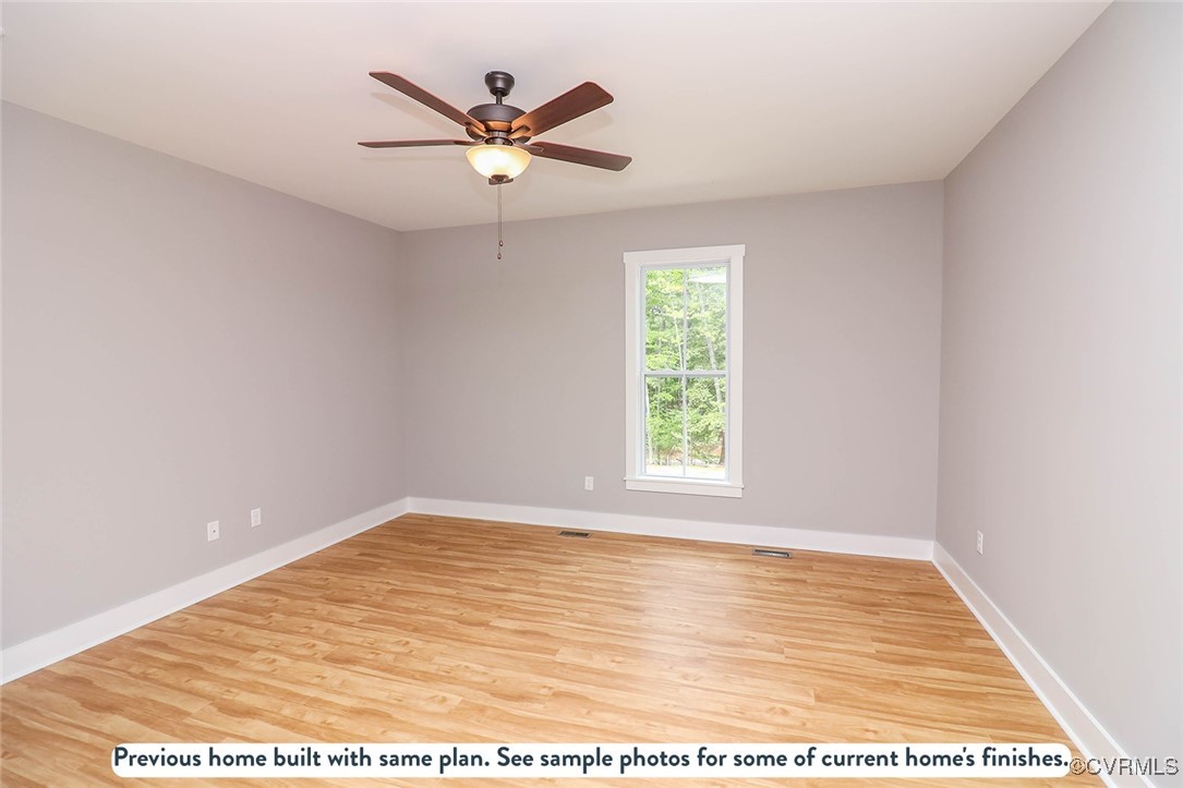 1676 Patterson Road Buckingham, VA 23921 - Photo 11 of 24 an empty room with wooden floor and windows