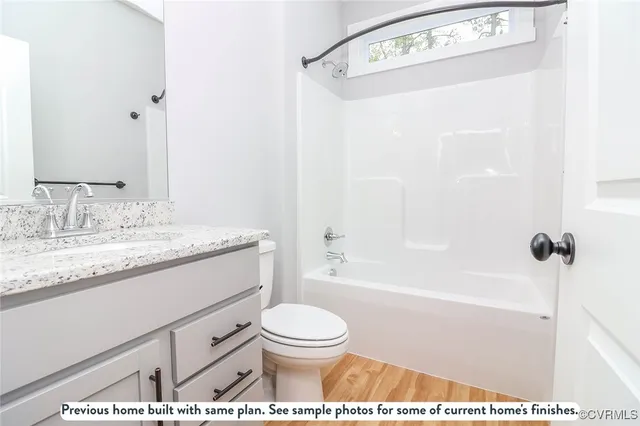 a view of house with a yard