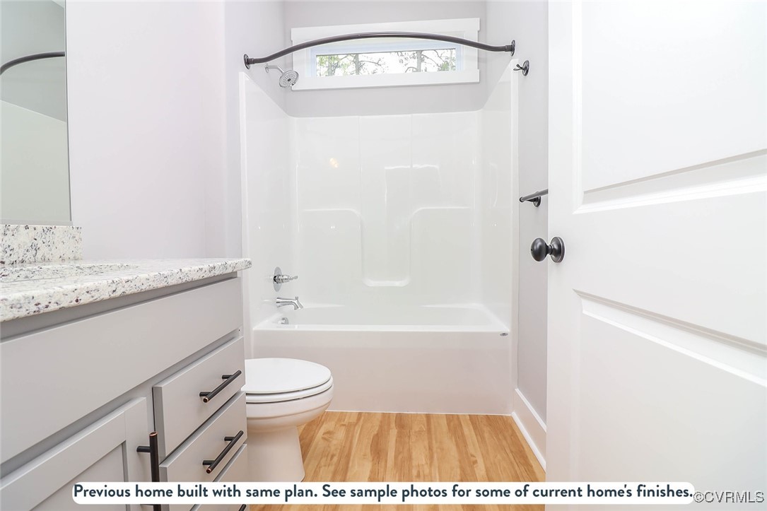 1676 Patterson Road Buckingham, VA 23921 - Photo 6 of 24 a bathroom with a granite countertop sink a toilet and bathtub
