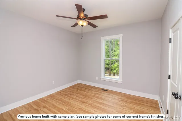 a bathroom with a granite countertop sink a toilet and bathtub