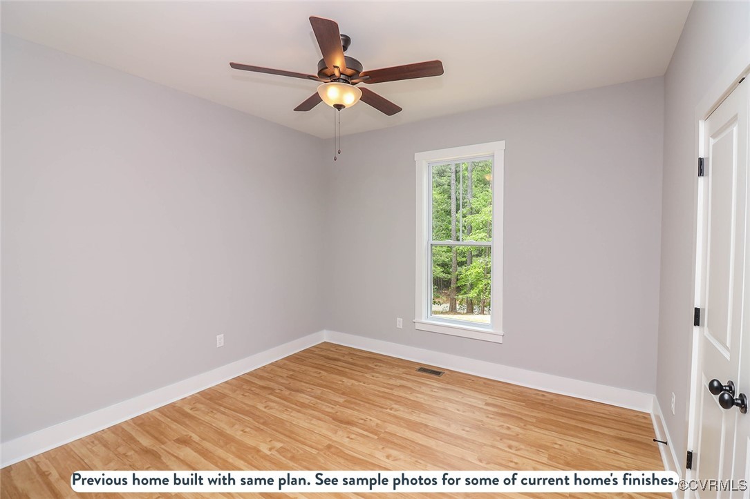 1676 Patterson Road Buckingham, VA 23921 - Photo 7 of 24 a view of a big room with wooden floor and windows