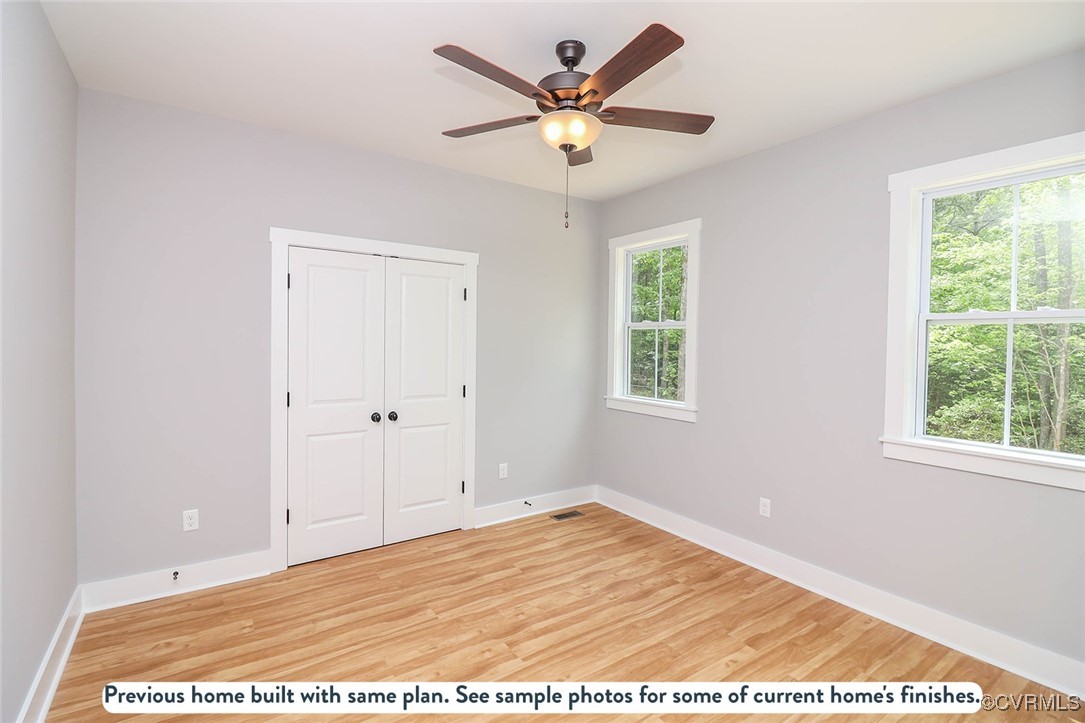 1676 Patterson Road Buckingham, VA 23921 - Photo 8 of 24 a view of an empty room with wooden floor and a window
