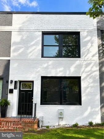 a front view of a house with garage