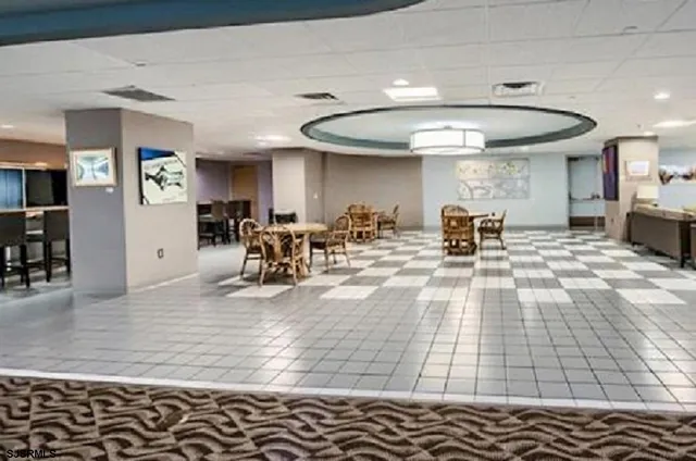 a view of a living room and kitchen