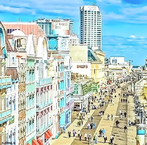 a view of a patio with a table and chairs under an umbrella