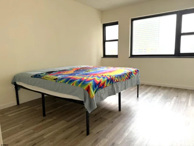 a bedroom with a bed and a table
