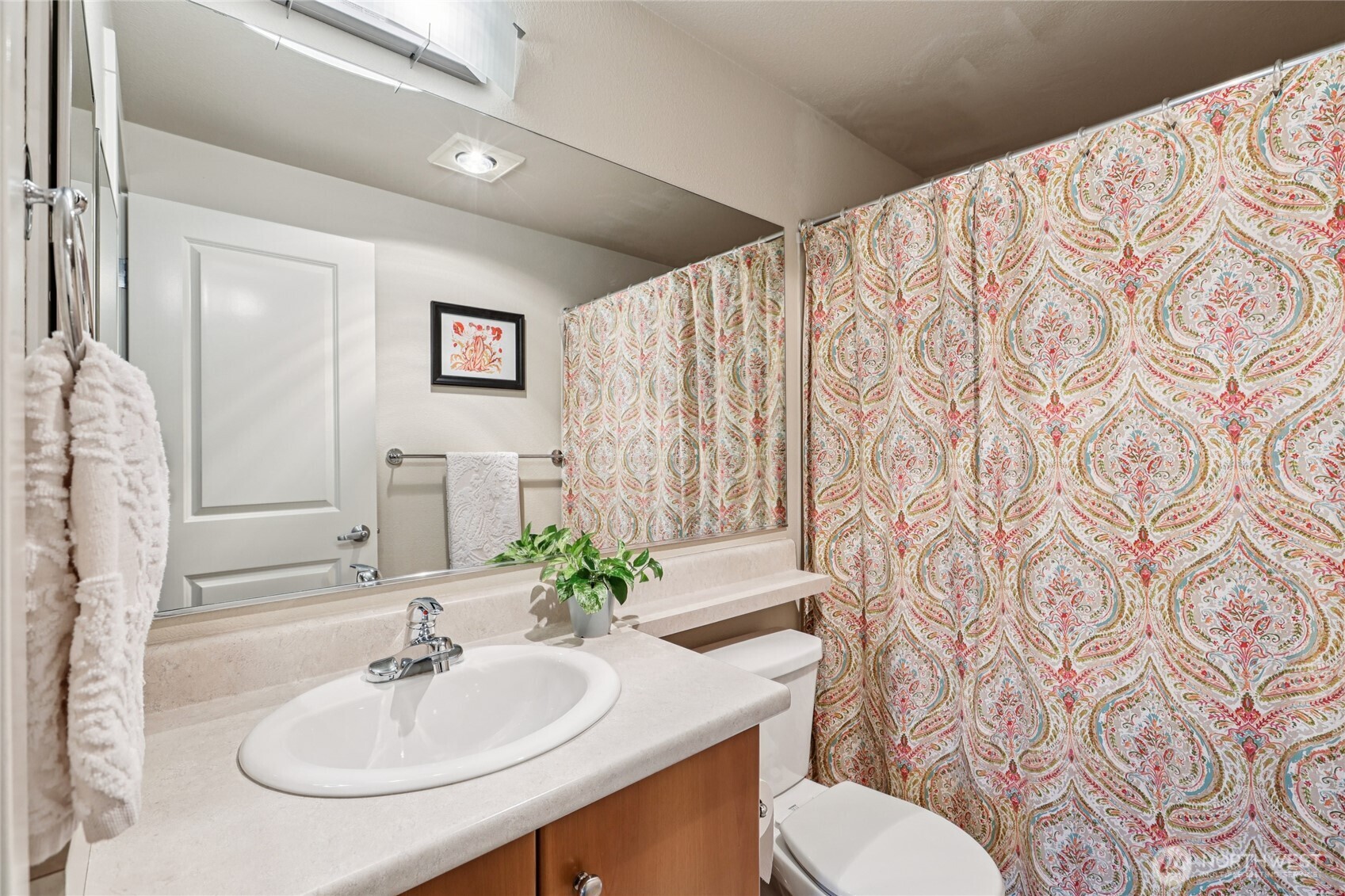 12404 East Gibson Road, Unit N203 Everett, WA 98204 - Photo 11 of 28 a bathroom with a sink toilet and mirror