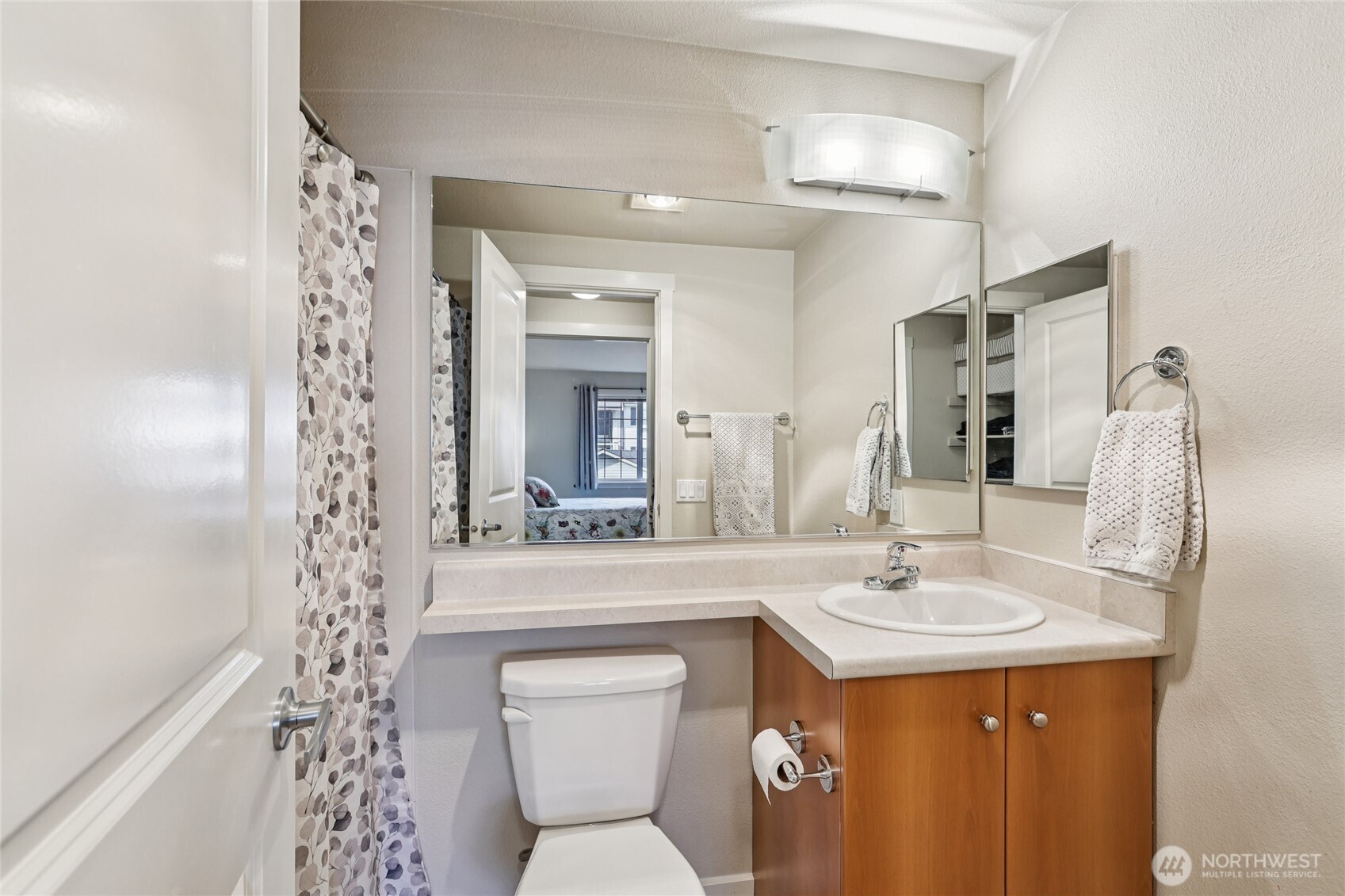 12404 East Gibson Road, Unit N203 Everett, WA 98204 - Photo 15 of 28 a bathroom with a sink toilet and shower