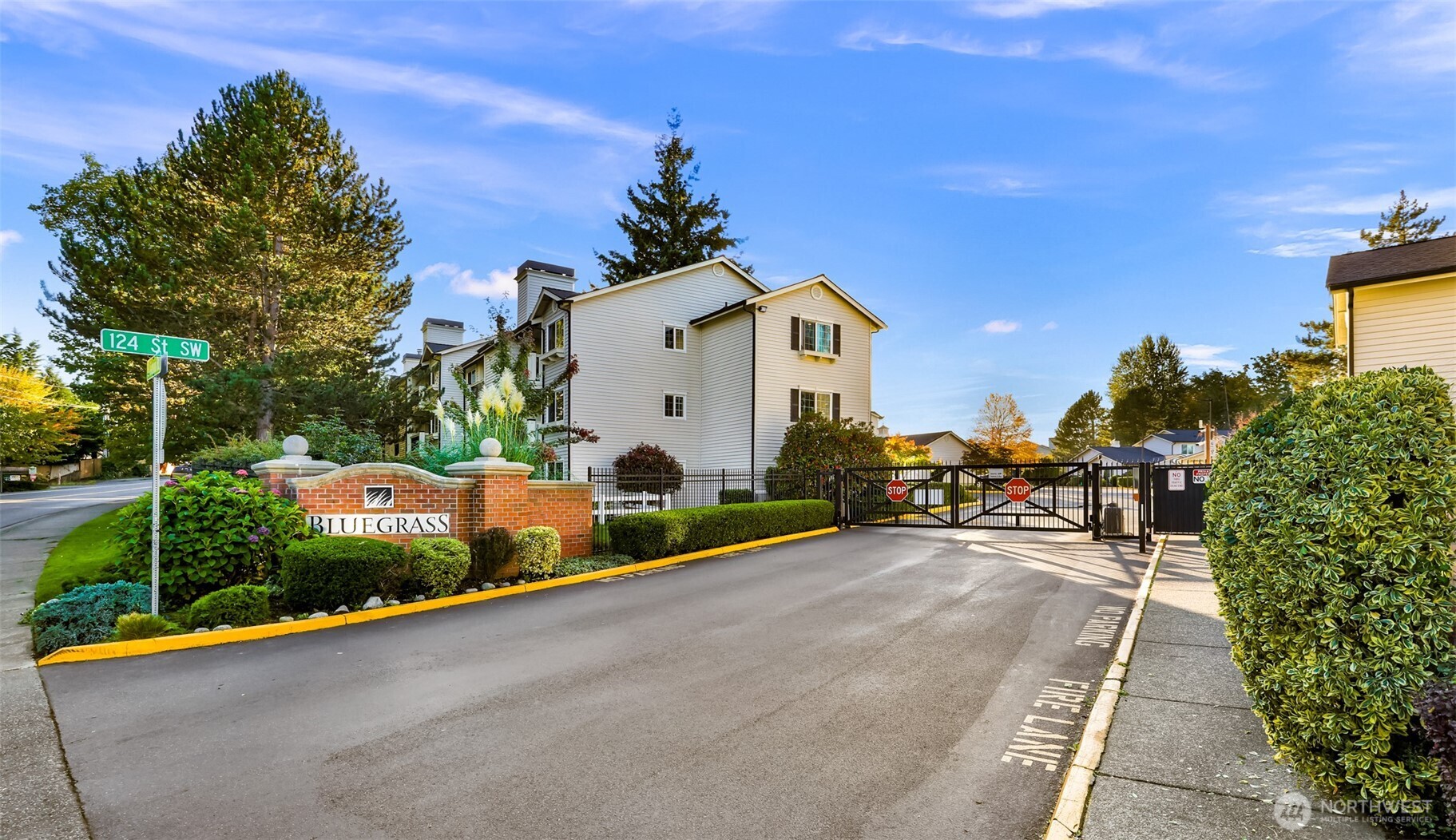 12404 East Gibson Road, Unit N203 Everett, WA 98204 - Photo 2 of 28 a view of a house with backyard and sitting area