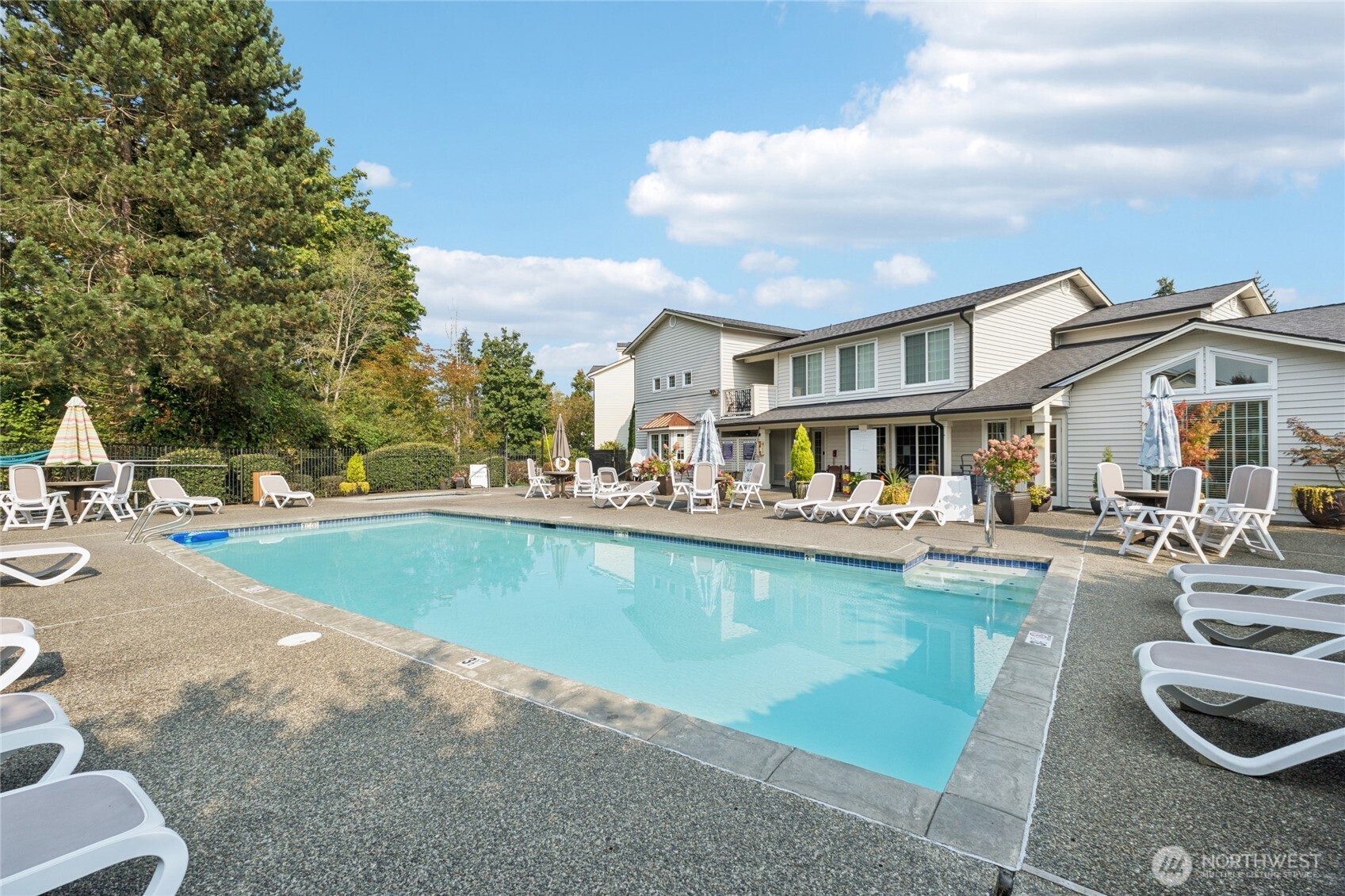 12404 East Gibson Road, Unit N203 Everett, WA 98204 - Photo 21 of 28 a view of a house with swimming pool and sitting area