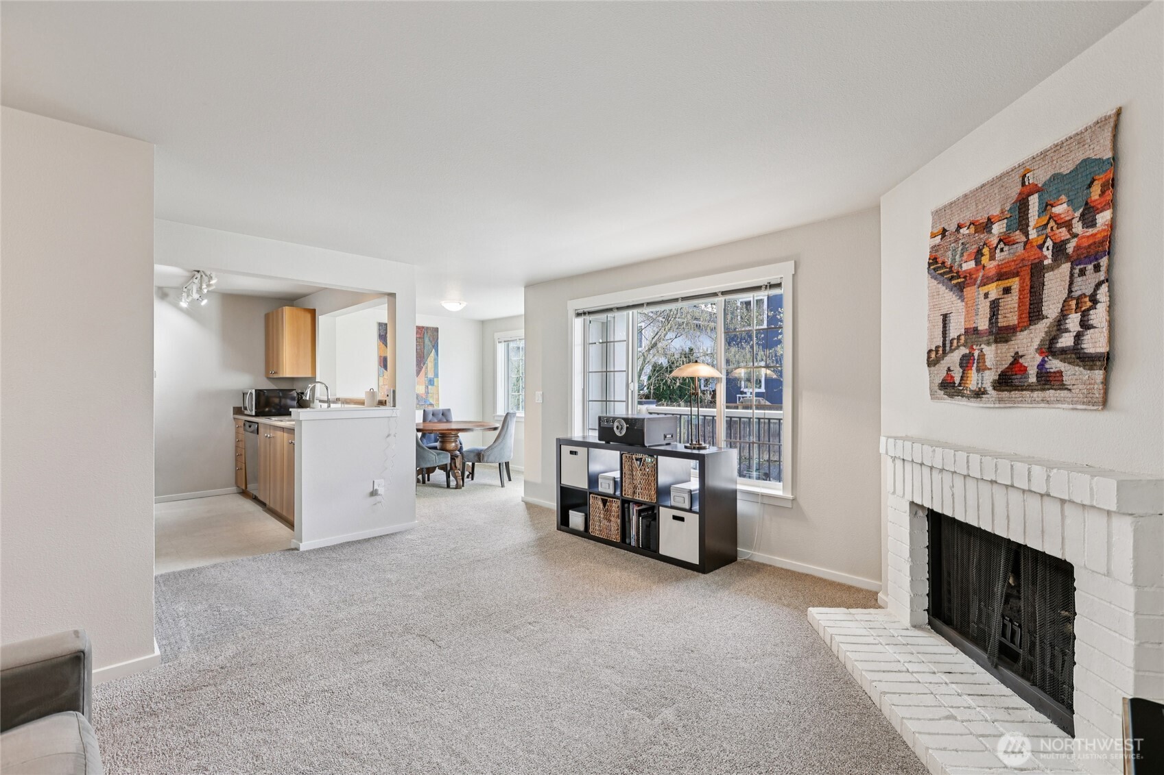 12404 East Gibson Road, Unit N203 Everett, WA 98204 - Photo 4 of 28 a living room with furniture and a fireplace