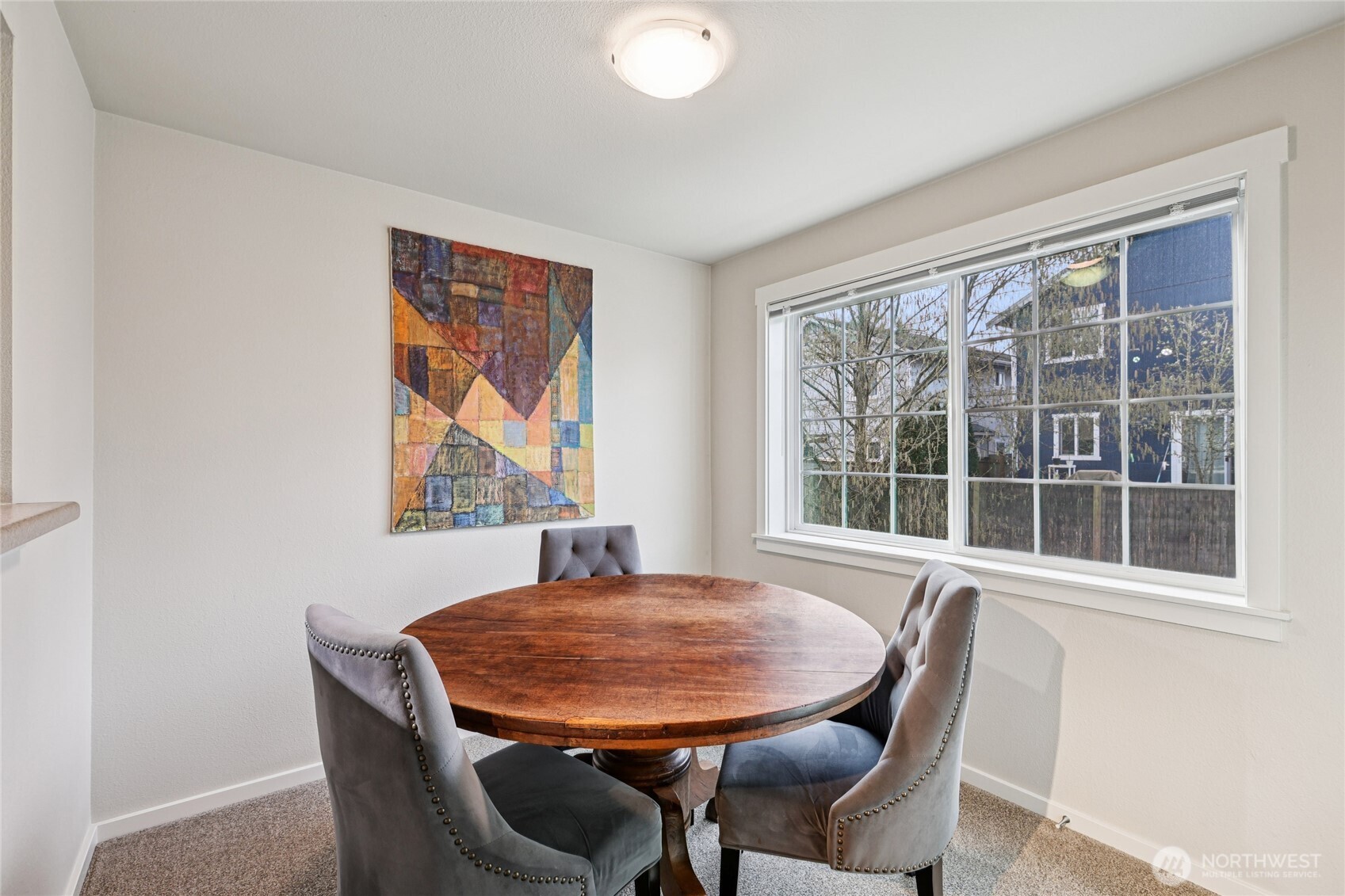 12404 East Gibson Road, Unit N203 Everett, WA 98204 - Photo 5 of 28 a view of a dining room with furniture large window and outside view