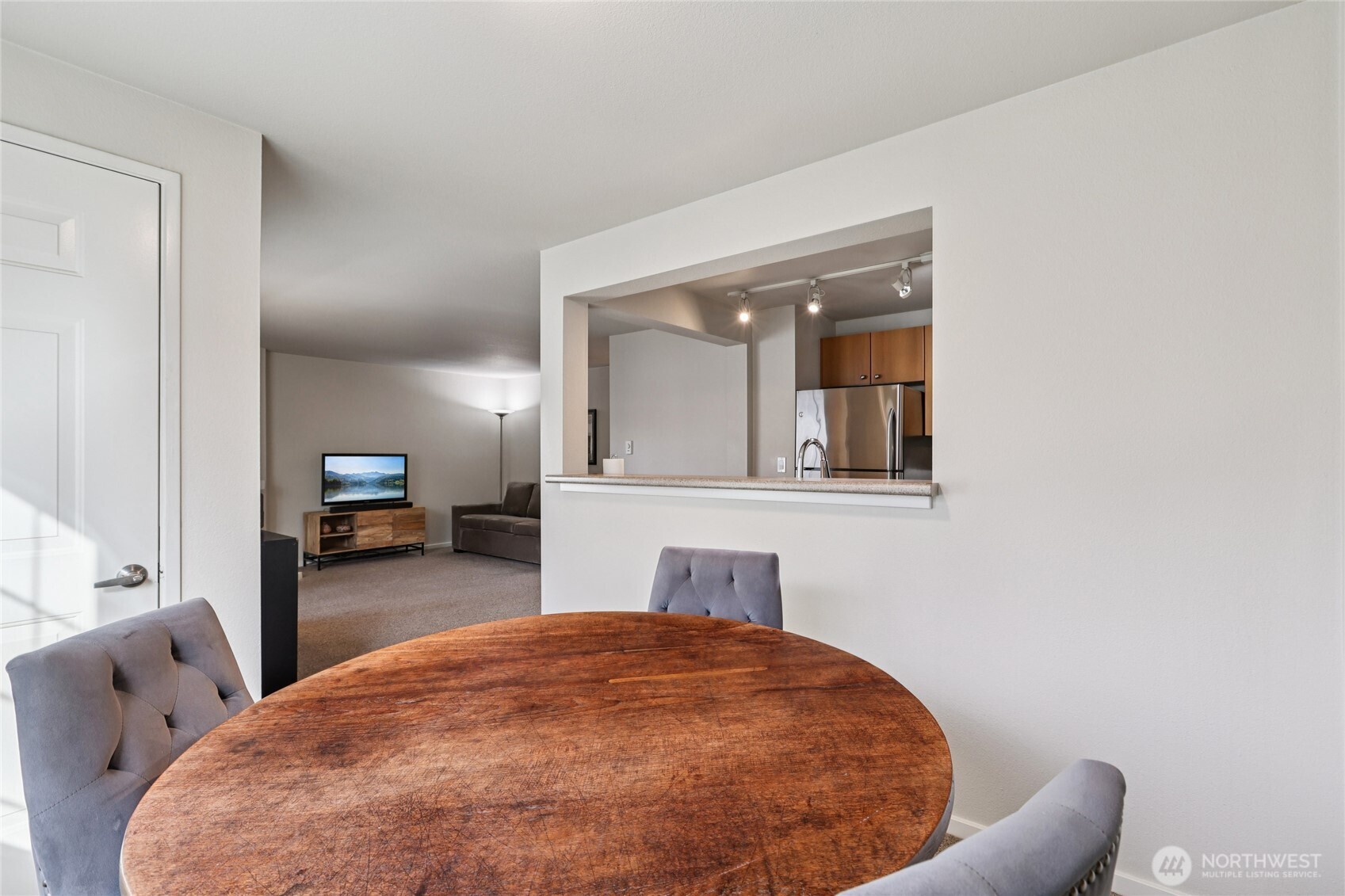 12404 East Gibson Road, Unit N203 Everett, WA 98204 - Photo 6 of 28 a bedroom with a bed and mirror