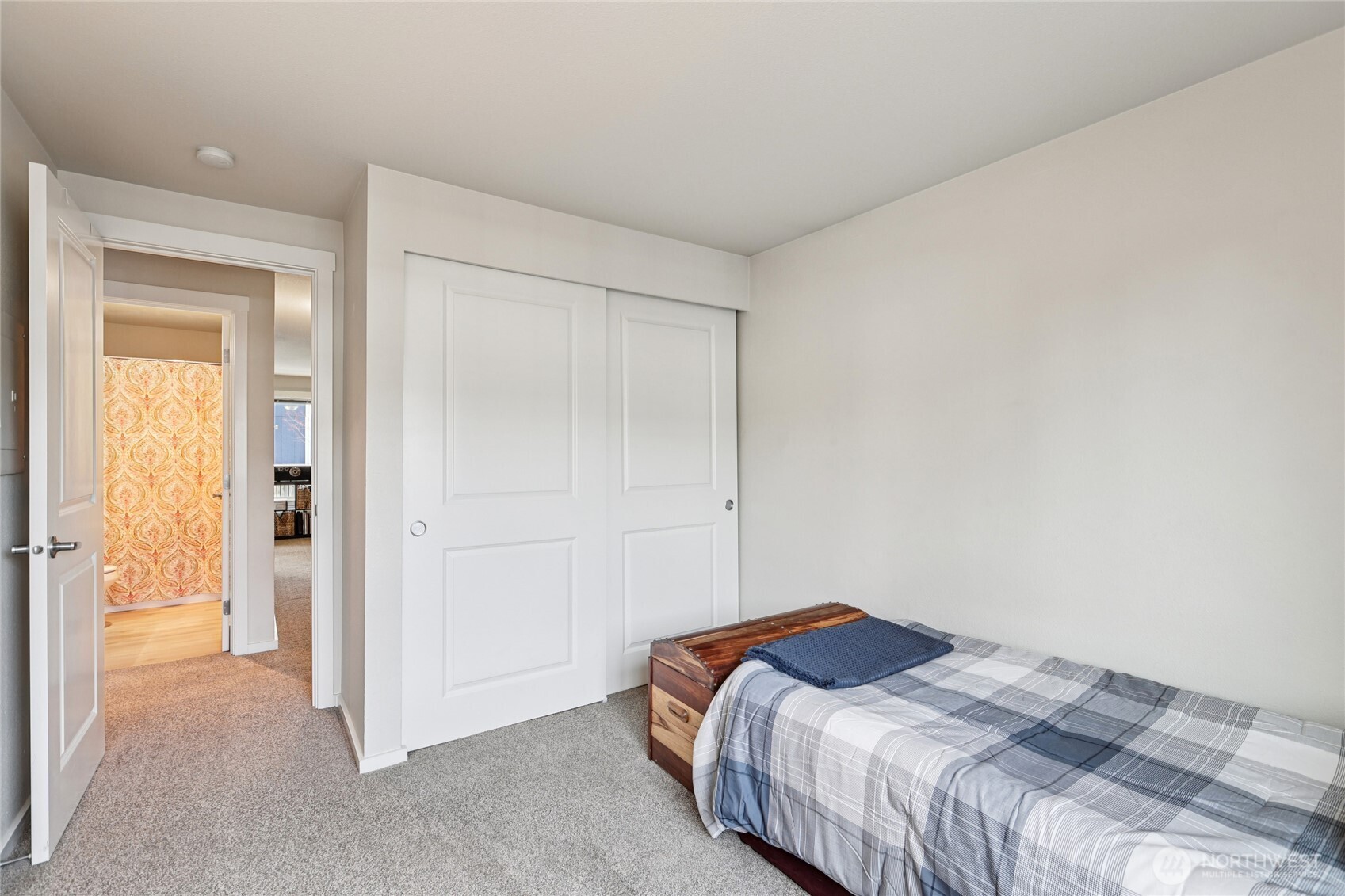 12404 East Gibson Road, Unit N203 Everett, WA 98204 - Photo 10 of 28 a bedroom with a bed and a cabinet