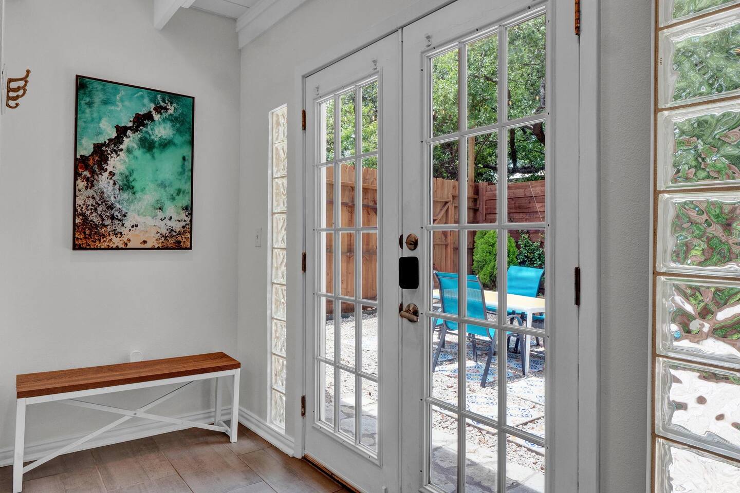 211 Lessin Lane, Unit B Austin, TX 78704 - Photo 3 of 18 Entryway featuring french doors, wood finished floors, and beam ceiling
