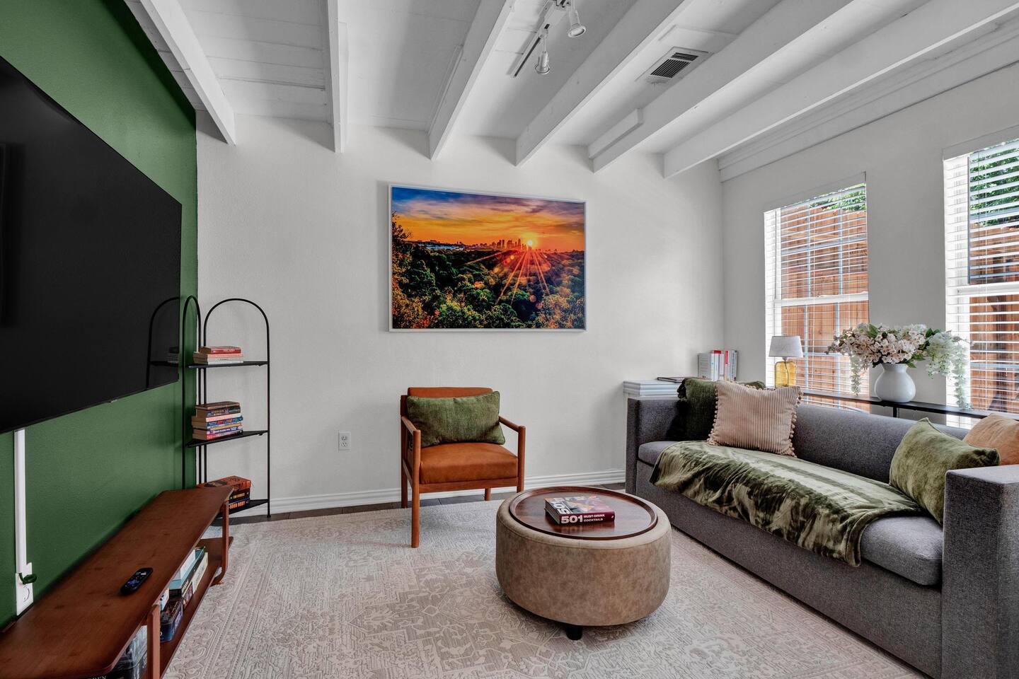 211 Lessin Lane, Unit B Austin, TX 78704 - Photo 5 of 18 Living area featuring beam ceiling and baseboards
