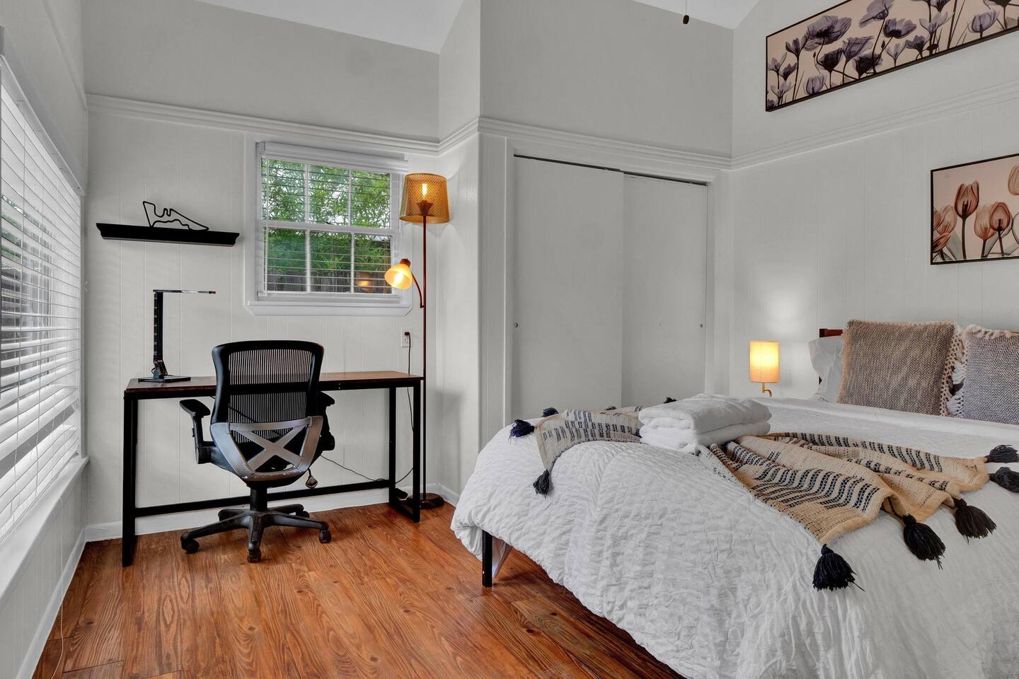 211 Lessin Lane, Unit B Austin, TX 78704 - Photo 9 of 18 Bedroom featuring wood finished floors, an office area, and a closet