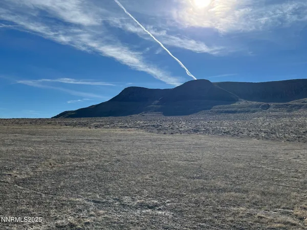 a view of ocean and a mountain