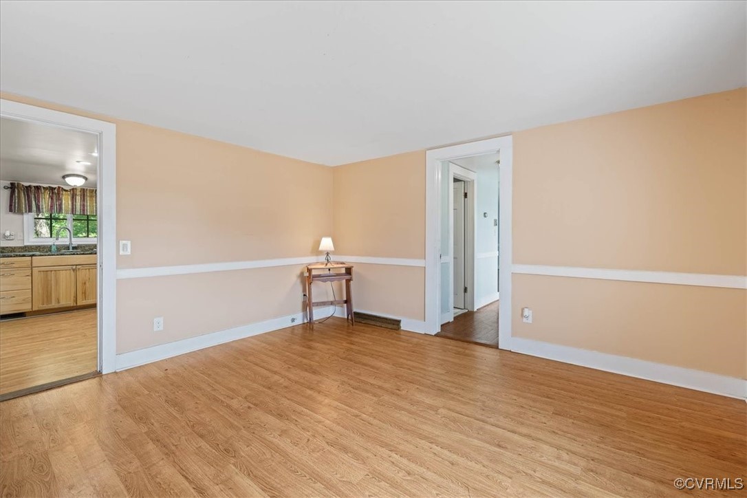 35161 Owens Grove Road Waverly, VA 23890 - Photo 11 of 35 Empty room featuring light wood finished floors, a