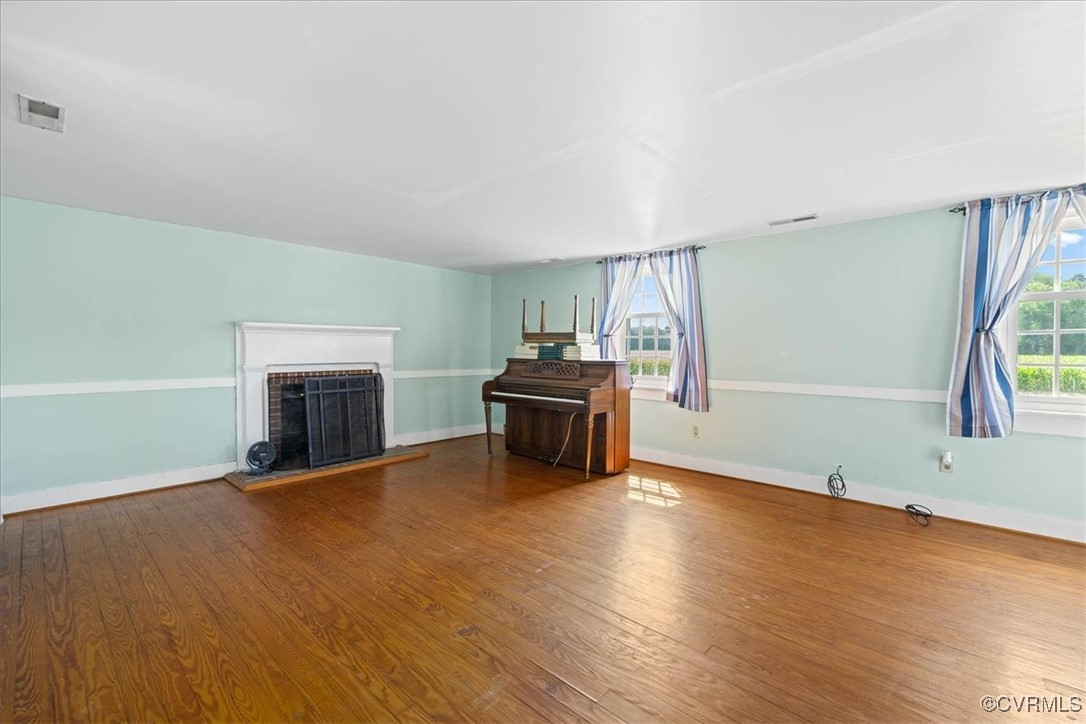 35161 Owens Grove Road Waverly, VA 23890 - Photo 13 of 35 Unfurnished living room with wood finished floors,