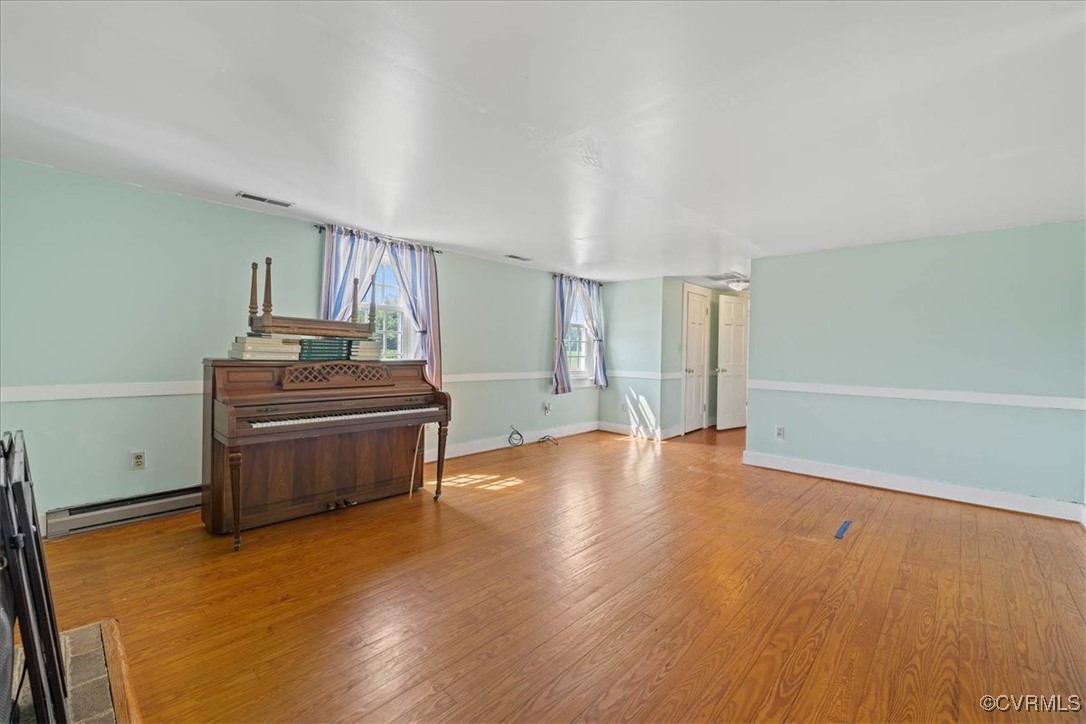35161 Owens Grove Road Waverly, VA 23890 - Photo 14 of 35 Living area with wood finished floors, baseboards,