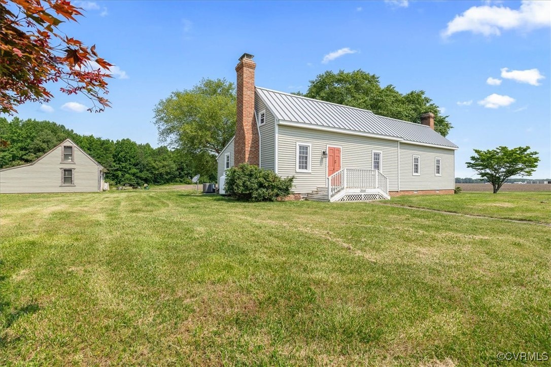 35161 Owens Grove Road Waverly, VA 23890 - Photo 4 of 35 View of side of property with a chimney, a lawn, a