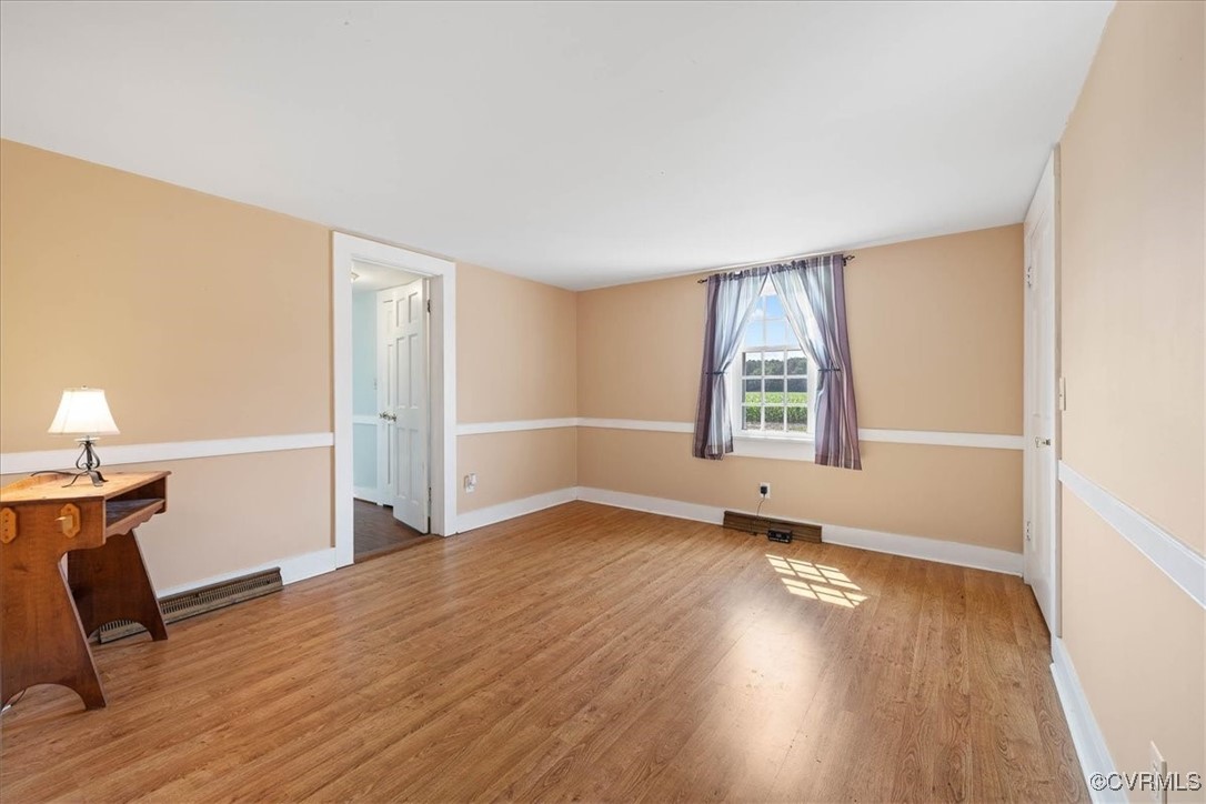 35161 Owens Grove Road Waverly, VA 23890 - Photo 10 of 35 Spare room with wood finished floors and baseboard