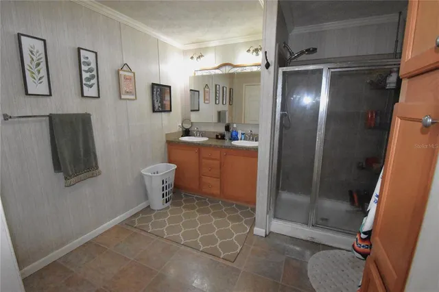 a kitchen with stainless steel appliances granite countertop a sink a stove and cabinets