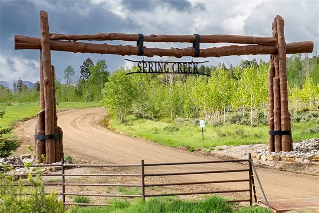 a view of a park with iron fence