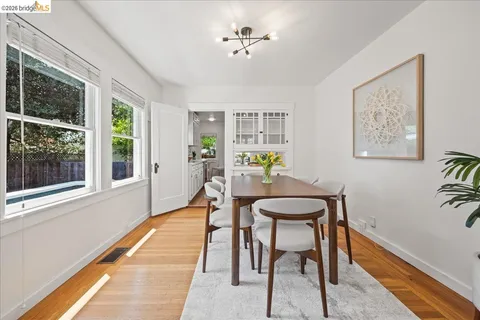 a large kitchen with kitchen island a large counter space a sink stainless steel appliances and cabinets
