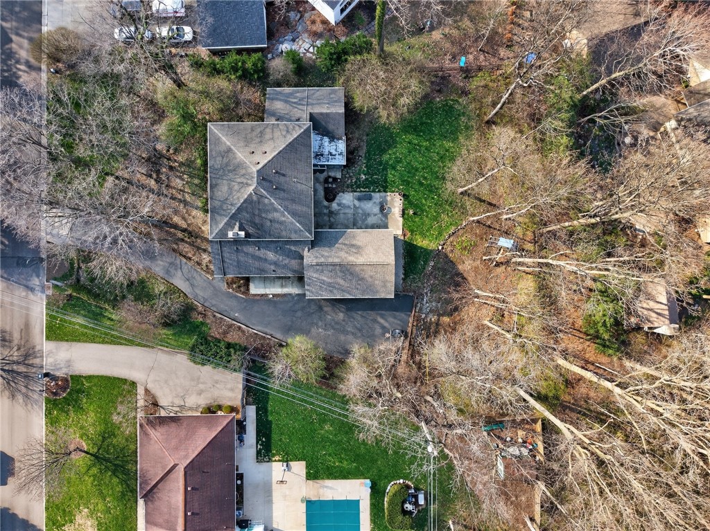 4747 Fawnwood Road Dayton, OH 45429 - Photo 56 of 58 An aerial view captures the property's expansive layout with a lush, green yard and surrounding trees.