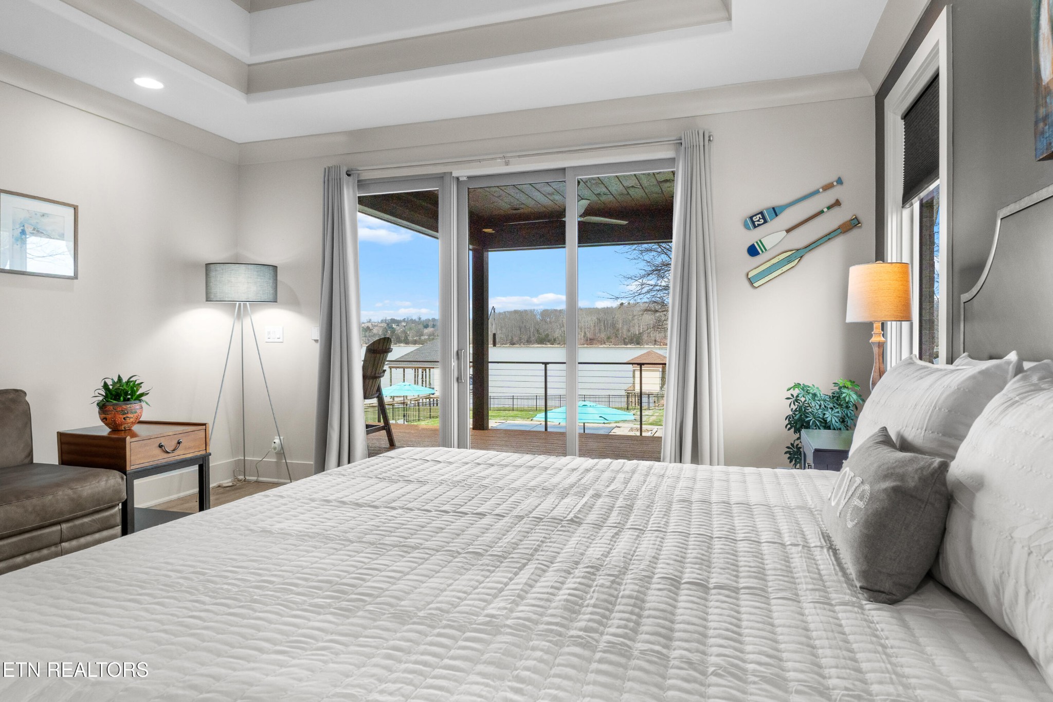 3702 Promontory Point Louisville, TN 37777 - Photo 19 of 60 a bedroom with a large bed and a large window