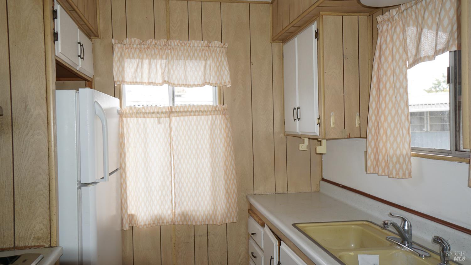 56 Ellie Drive Santa Rosa, CA 95403 - Photo 5 of 17 a bathroom with a granite countertop sink and a mirror