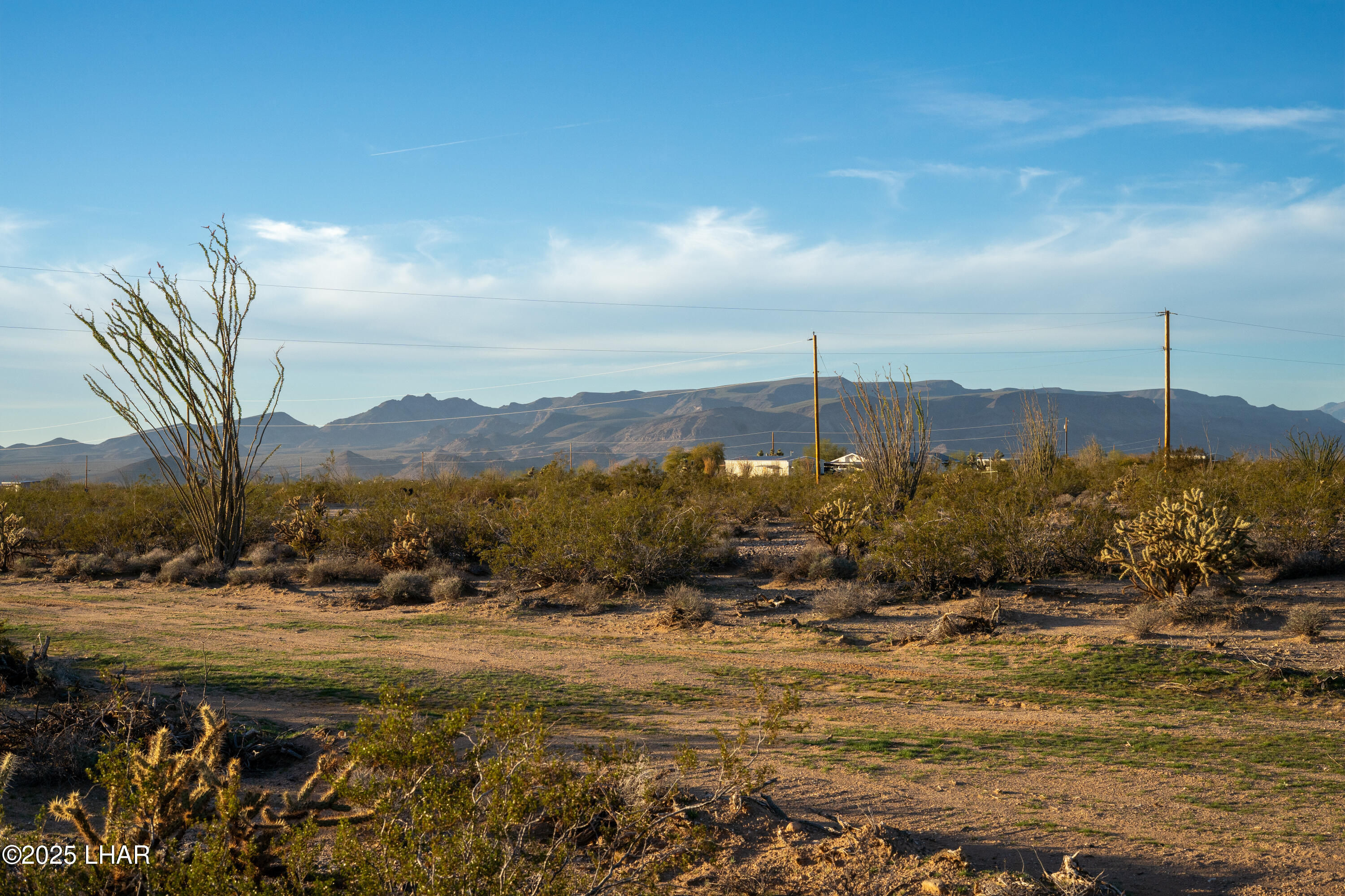 Lot 29 South Carmen Road Yucca, AZ 86438 - Photo 18 of 22 a view of a town with mountains in the background