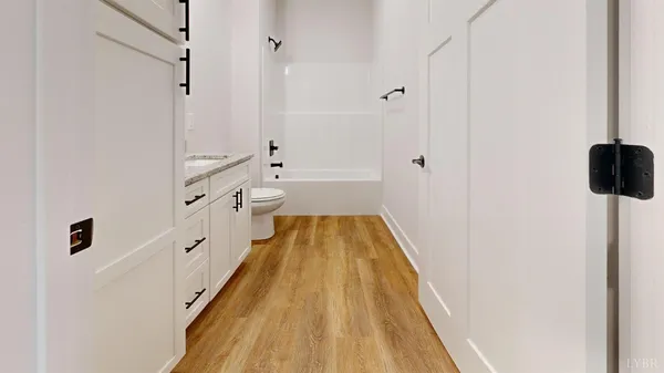 a bathroom with a bathtub and shower
