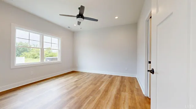 a view of room with window and hardwood floor