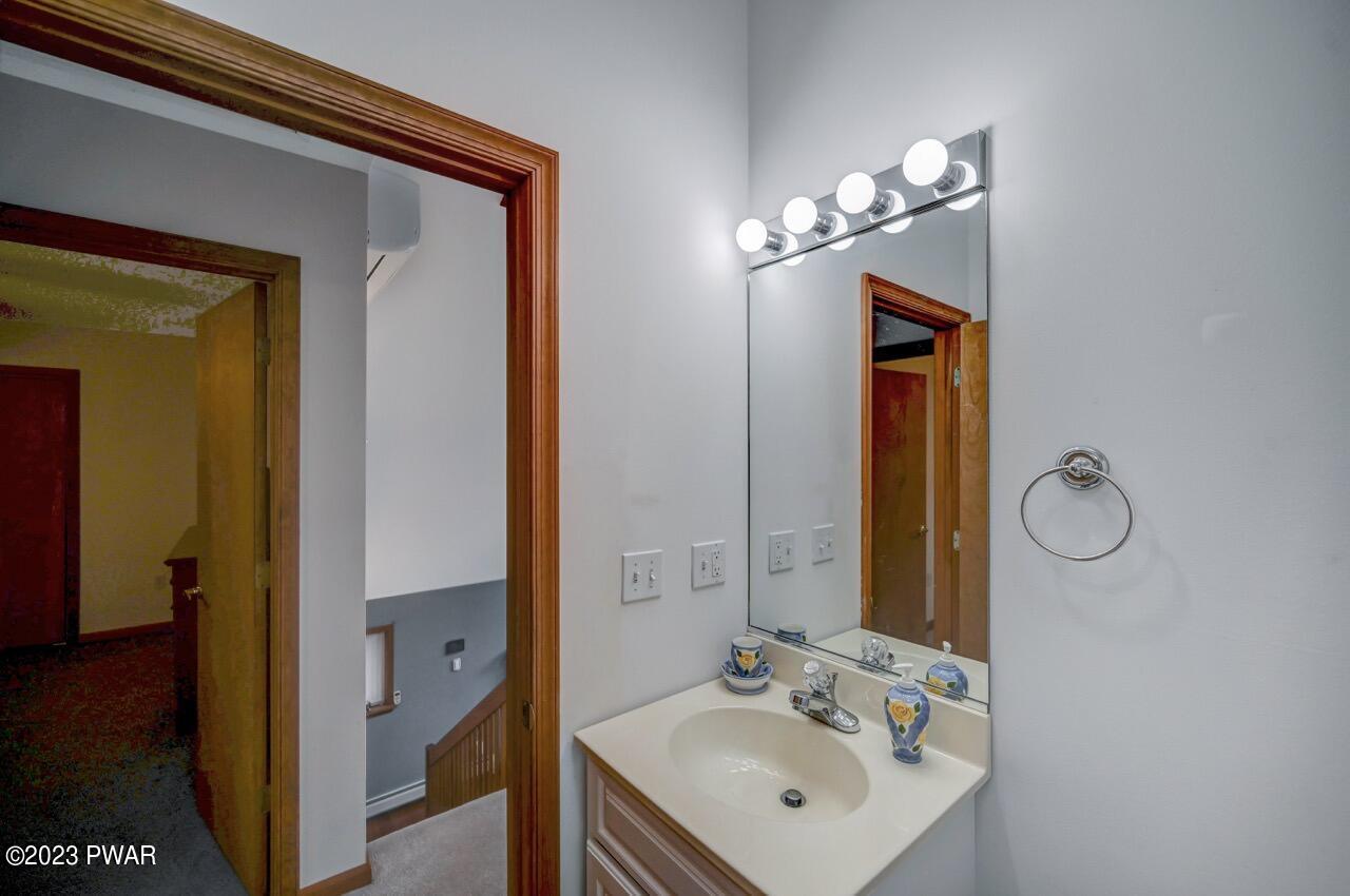 1294 Brookfield Road Lake Ariel, PA 18436 - Photo 41 of 75 a bathroom with a sink and a mirror