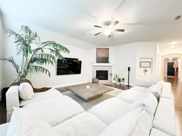 a bedroom with a bed and ceiling fan