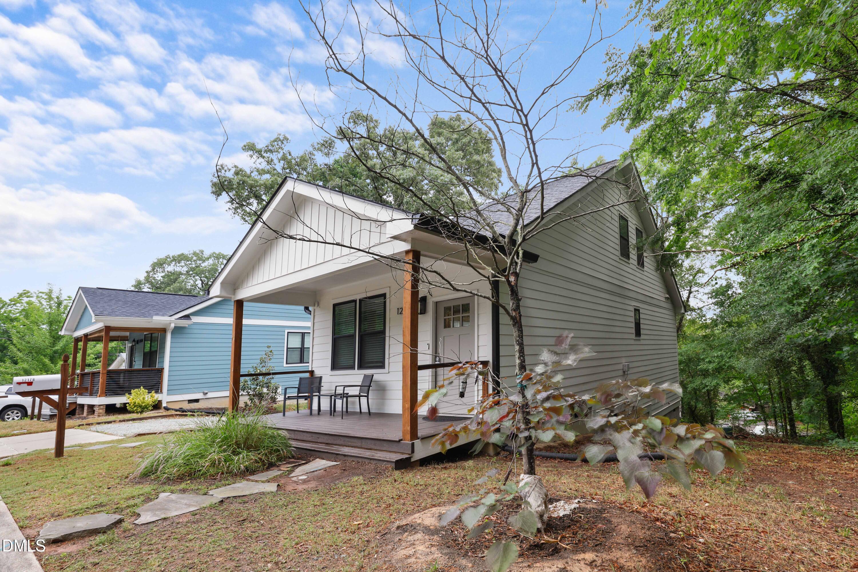 1217 Rosedale Avenue, Unit B Durham, NC 27707 - Photo 2 of 24 a front view of a house with garden