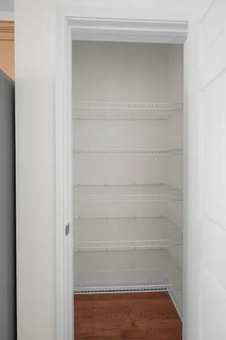 a bathroom with a sink mirror and toilet