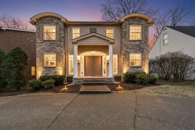 a view of a brick building with large windows
