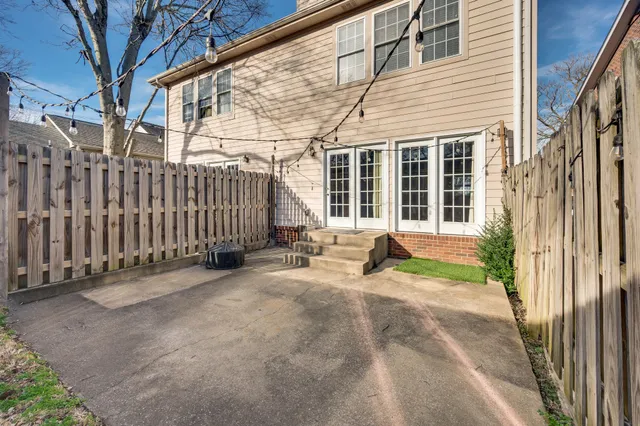 a view of a house with a wooden fence