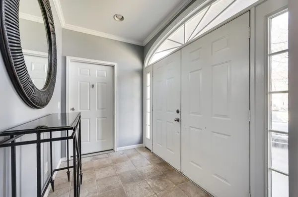a view of a hallway with painted walls and stairs